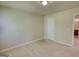 Spacious bedroom featuring carpet and a large door, bright with natural light at 11224 Aliyah Dr, Hampton, GA 30228