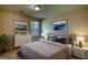 Comfortable bedroom featuring neutral colors, a patterned rug, and plenty of natural light at 11224 Aliyah Dr, Hampton, GA 30228