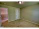 Bedroom featuring carpet flooring and neutral colored walls, bright with natural light at 11224 Aliyah Dr, Hampton, GA 30228