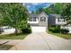 Charming two-story home boasts a combination of light beige siding and gray brick, and a two-car garage at 11224 Aliyah Dr, Hampton, GA 30228