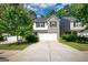 Charming two-story home boasts a combination of light beige siding and gray brick, and a two-car garage at 11224 Aliyah Dr, Hampton, GA 30228