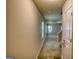 Inviting hallway with neutral walls and carpet leads to the living areas of the home at 11224 Aliyah Dr, Hampton, GA 30228