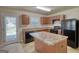 Modern kitchen with updated appliances, island, and direct access to the outdoors at 11224 Aliyah Dr, Hampton, GA 30228