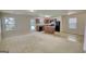 Spacious living room and kitchen combo with natural light, perfect for entertaining at 11224 Aliyah Dr, Hampton, GA 30228