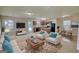 Spacious living room with stylish furniture, an open layout, and hardwood flooring, perfect for entertaining at 11224 Aliyah Dr, Hampton, GA 30228