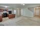 Open-concept living space with neutral carpet and easy access to the kitchen and staircase at 11224 Aliyah Dr, Hampton, GA 30228
