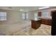Open floorplan living room and kitchen with a kitchen island and plentiful windows at 11224 Aliyah Dr, Hampton, GA 30228