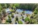 Community amenities include tennis courts and swimming pool surrounded by lush greenery and mature trees at 105 Suffolk Pl, Fayetteville, GA 30215