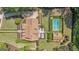 Stunning aerial view of a property featuring a well-maintained lawn, pool, and beautiful landscaping at 105 Suffolk Pl, Fayetteville, GA 30215