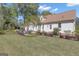 An expansive backyard featuring a dining area and lush green lawn at 105 Suffolk Pl, Fayetteville, GA 30215