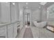 Bright bathroom featuring a freestanding tub, dual vanity, and elegant finishes throughout at 105 Suffolk Pl, Fayetteville, GA 30215