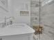 Bright bathroom featuring white marble walls, a glass shower and a toilet at 105 Suffolk Pl, Fayetteville, GA 30215