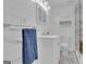 All white bathroom with silver accents and a blue towel on the towel rack at 105 Suffolk Pl, Fayetteville, GA 30215
