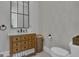Charming bathroom with a wooden vanity and stylish mirror at 105 Suffolk Pl, Fayetteville, GA 30215