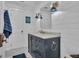 Bright bathroom with a marble countertop, bronze fixtures, and modern wall paneling at 105 Suffolk Pl, Fayetteville, GA 30215
