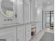 Bathroom vanity area with marble countertops, custom cabinets, and view of bedroom at 105 Suffolk Pl, Fayetteville, GA 30215