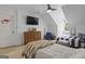 Bright bedroom with hardwood floors, a cozy bed, and a charming window seat at 105 Suffolk Pl, Fayetteville, GA 30215