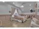Airy bedroom with a cozy bed, soft lighting, and elegant décor at 105 Suffolk Pl, Fayetteville, GA 30215