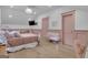 Comfortable bedroom with soft pink accents, stylish lighting, and spacious layout at 105 Suffolk Pl, Fayetteville, GA 30215