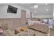 Charming bedroom with elegant furnishings, including a plush ottoman and stylish decor at 105 Suffolk Pl, Fayetteville, GA 30215