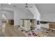 Bright bonus room with hardwood floors, sloped ceilings and a colorful rug at 105 Suffolk Pl, Fayetteville, GA 30215