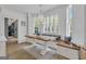 Bright dining area with a chandelier, bench seating, and large windows at 105 Suffolk Pl, Fayetteville, GA 30215
