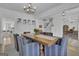 Open-concept dining area with an elegant chandelier and direct access to the staircase at 105 Suffolk Pl, Fayetteville, GA 30215