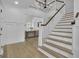 Grand entryway with a staircase, hardwood floors, and a view into the living area at 105 Suffolk Pl, Fayetteville, GA 30215