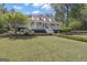 Spacious home with a well-kept lawn and large front porch at 105 Suffolk Pl, Fayetteville, GA 30215