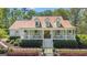 Beautiful home featuring a charming front porch and well-manicured landscaping at 105 Suffolk Pl, Fayetteville, GA 30215