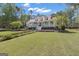 Lovely home with a manicured front lawn and inviting porch at 105 Suffolk Pl, Fayetteville, GA 30215