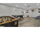 Wide shot of a game room featuring a foosball and an air hockey table at 105 Suffolk Pl, Fayetteville, GA 30215