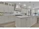 Gourmet kitchen with white cabinets, marble countertops, and stainless steel appliances at 105 Suffolk Pl, Fayetteville, GA 30215