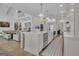 Gourmet kitchen with white cabinets, marble countertops, and stainless steel appliances at 105 Suffolk Pl, Fayetteville, GA 30215