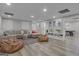 A cozy living room with a sectional sofa, beanbag chairs, and light wood floors at 105 Suffolk Pl, Fayetteville, GA 30215