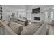 Spacious living room boasts a fireplace, comfortable seating, and seamless flow to the kitchen area at 105 Suffolk Pl, Fayetteville, GA 30215