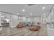 Open floor plan showcasing the living room with a comfortable sectional and view into the bedroom at 105 Suffolk Pl, Fayetteville, GA 30215