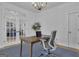 Bright office features hardwood floors, and a gray chair at 105 Suffolk Pl, Fayetteville, GA 30215
