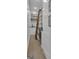 Walk-in pantry features a rolling ladder, wine fridge, countertop, and open shelving at 105 Suffolk Pl, Fayetteville, GA 30215