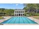Community pool and clubhouse offers a relaxing retreat for residents with lounge chairs and ample space at 105 Suffolk Pl, Fayetteville, GA 30215