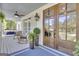 Cozy front porch with comfortable seating, ceiling fan and an inviting entryway at 105 Suffolk Pl, Fayetteville, GA 30215