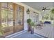 Charming porch with rocking chairs and swing, perfect for relaxing and enjoying the outdoors at 105 Suffolk Pl, Fayetteville, GA 30215