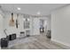 Relaxing room with white walls, wood floors, guitars, and a comfortable chair at 105 Suffolk Pl, Fayetteville, GA 30215