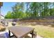 Cozy backyard with a table, ideal for outdoor gatherings at 9929 Musket Ridge Cir, Jonesboro, GA 30238