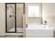 Elegant bathroom features a separate shower and soaking tub for a spa-like experience at 9929 Musket Ridge Cir, Jonesboro, GA 30238