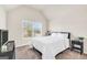 Bright bedroom with vaulted ceiling, a bed, and a window that provides natural light at 9929 Musket Ridge Cir, Jonesboro, GA 30238