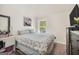 Bright bedroom with a comfortable bed, natural light, and simple decor at 9929 Musket Ridge Cir, Jonesboro, GA 30238