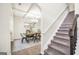 Elegant dining room adjacent to staircase at 9929 Musket Ridge Cir, Jonesboro, GA 30238