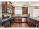 Well-appointed kitchen with stainless steel appliances, granite countertops, and tile backsplash at 9929 Musket Ridge Cir, Jonesboro, GA 30238