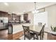 Eat-in kitchen offers stainless steel appliances, a breakfast table and wooden cabinetry at 9929 Musket Ridge Cir, Jonesboro, GA 30238
